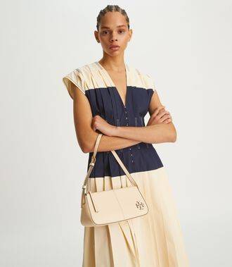 TORY BURCH MCGRAW WEDGE กระเป๋าสะพายไหล่ ทรงสวยไม่ซ้ำ ไม่เกร่อ!! สะดวกใช้งาน ดีไซน์เรียบแต่แฝงความหรู และคลาสสิคในตัว วัสดุหนังลูกวัว สัมผัสดี สวยคม เปิด-ปิดด้วยซิป ภายในเป็นช่องโล่ง มีช่องย่อยเก็บบัตร มาพร้อมสายสะพายในตัว ปรับได้อีกเล็กน้อย ไอเท็มนี้เหมา