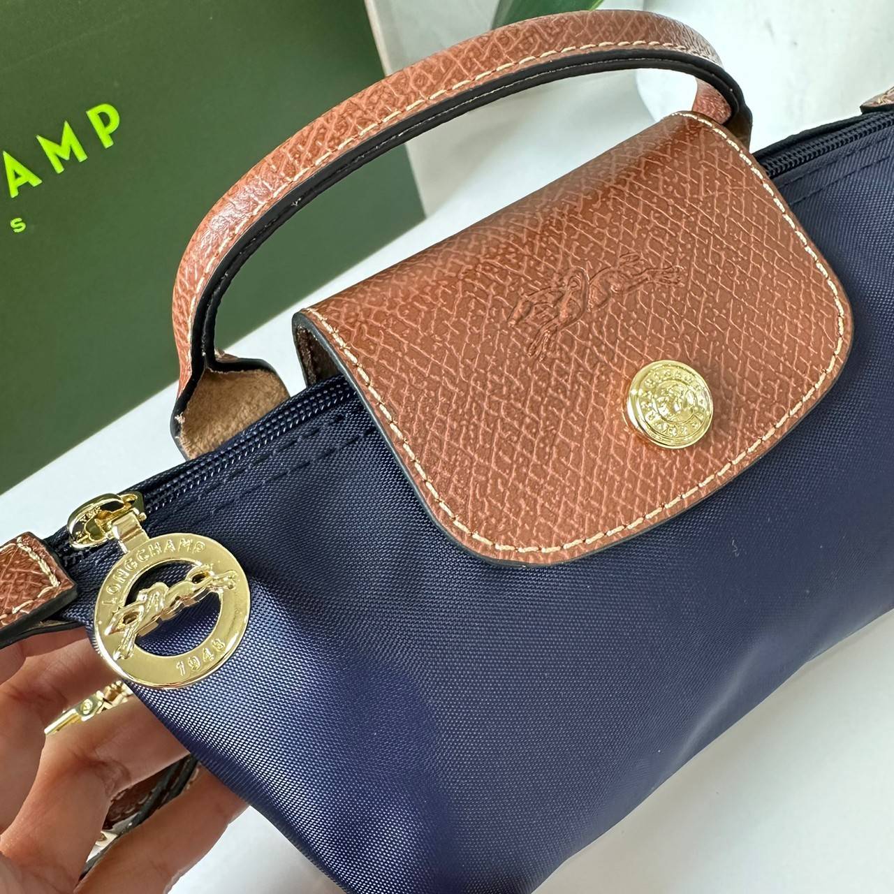 LONGCHAMP LE PLIAGE ORIGINAL Pouch with handle กระเป๋าใบเล็กขนาดกระทัดเหมาะกับใส่ของจำเป็นจุกจิก กันน้ำได้ พร้อมส่ง