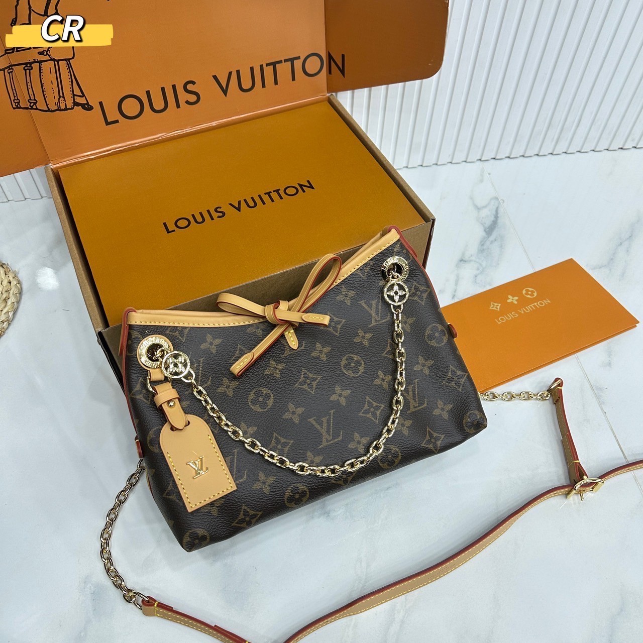 LV CarryAll BB bag Monogram Canvas กระเป๋าสะพายแครี่ออล ไซส์ใหม่ ดีไซส์ใหม่สุดไอคอนิกปรับโฉมใหม่ประจำฤดูกาลในดีไซน์สุดชิค ตกแต่งสายโซ่สีทองงดงามด้วย Monogram Flower