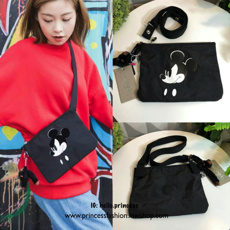 Kipling MAY Small 2-in-1 Pouch and Crossbody กระเป๋าสะพายหรือคาดเอว ขนาดมินิรุ่น Limited ทรงน่ารัก น้ำหนักเบา ใช้ได้ทั้งสองด้าน ด้านหน้ามีสกรีน mickey mouse ด้านหลังประดับโลโก้ มาพร้อมพวงกุญแจแบรนด์ เปิดปิดด้วยซิปสะดวกใช้ หัวซิปแบรนด์ มีหนึ่งช่องซิป และสา