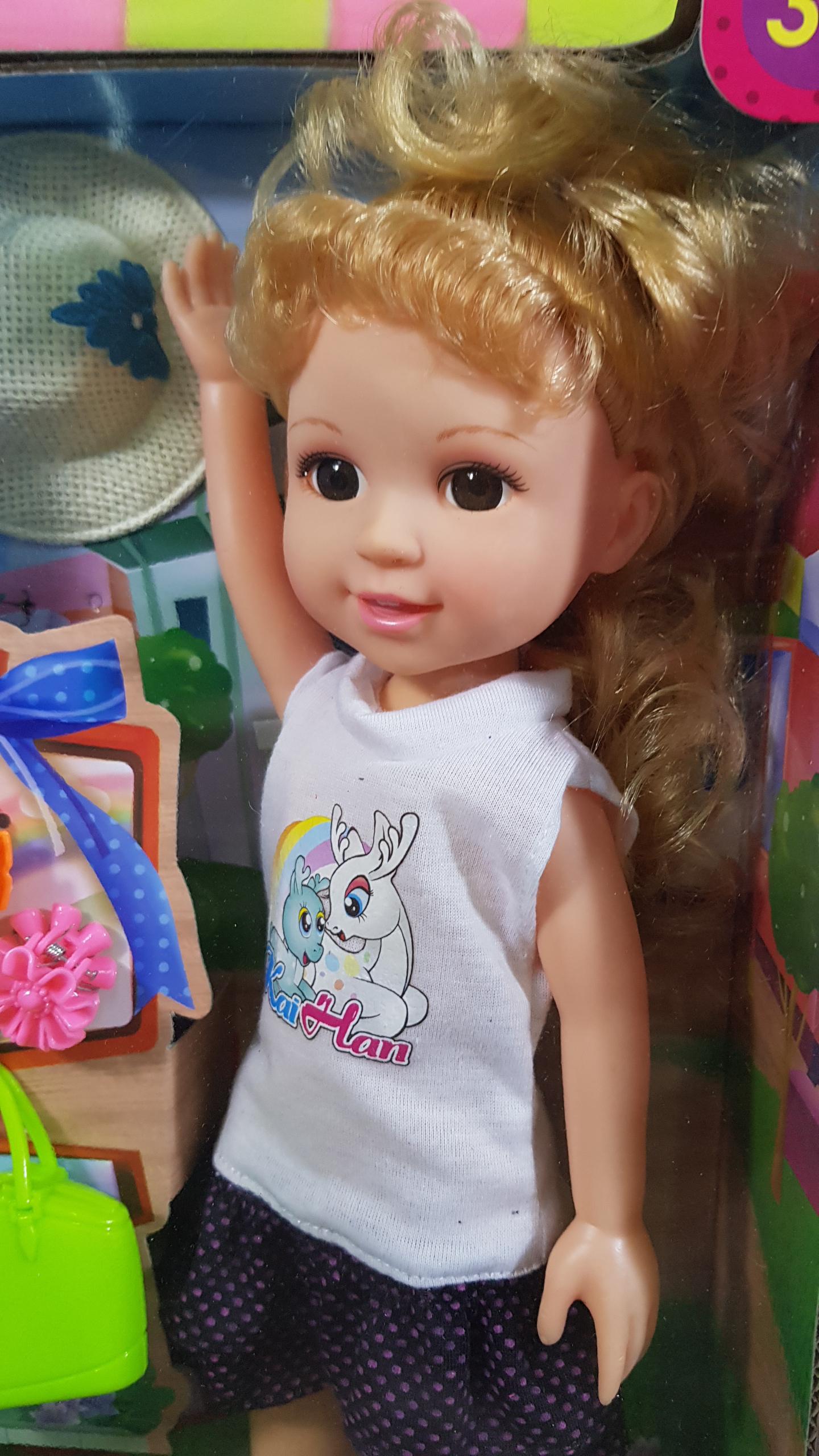 ตุ๊กตาเด็กผู้หญิงตาใสกระเป๋าเขียว