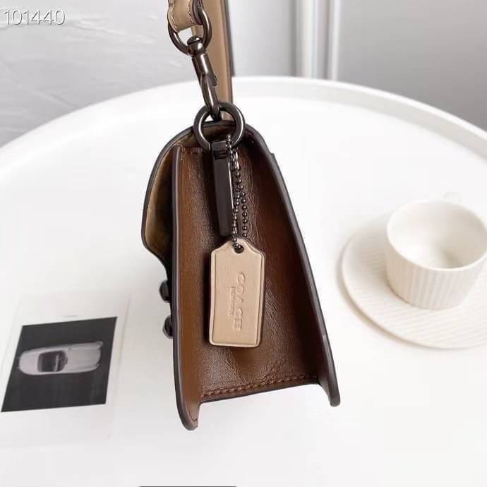 Coach Tabby Shoulder Bag 26 Polished pebble leather, suede and refined calf leather Inside zip and multifunction pockets