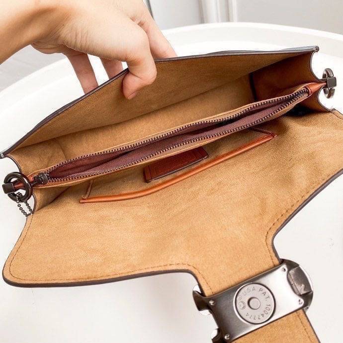 Coach Tabby Shoulder Bag 26 Polished pebble leather, suede and refined calf leather Inside zip and multifunction pockets