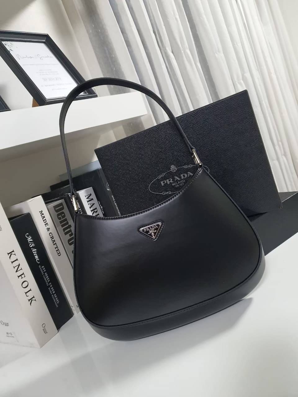 Prada Cleo brushed leather shoulder bag กระเป๋าทรงสวยยอดฮิต กับแบรนด์ PRADA งานพรีเมียมกิ้ฟท์จากแบรนด์ ทรงสะพายไหล่สวยหรูอยู่ทรง PRADA CLEO หนังเรียบดำเงาหรูสุดคลาสสิต เปิดปิดด้วยกระดุมอะไหล่เงินทั้งใบ ด้านในใส่กระเป๋าสตางค์ยาว มือถือ ของจุกจิกได้เยอะ มีป