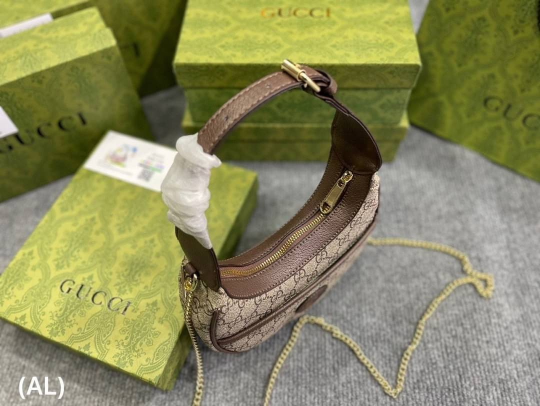 GUCCI half-moon Ophidia mini shoulder bag กระเป๋าสะพายไหล่รูปทรงพระจันทร์เสี้ยว Canvas GG Supreme กระเป๋าขนาดมินิให้ความรู้สึกย้อนยุคอันโดดเด่น สไตส์วินเทจ