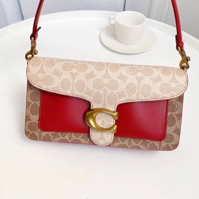 Coach Tabby Shoulder Bag 26 Polished pebble leather, suede and refined calf leather Inside zip and multifunction pockets