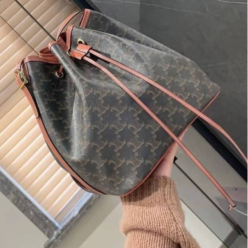 CELINE MEDIUM DRAWSTRING BAG IN TRIOMPHE CANVAS TAN