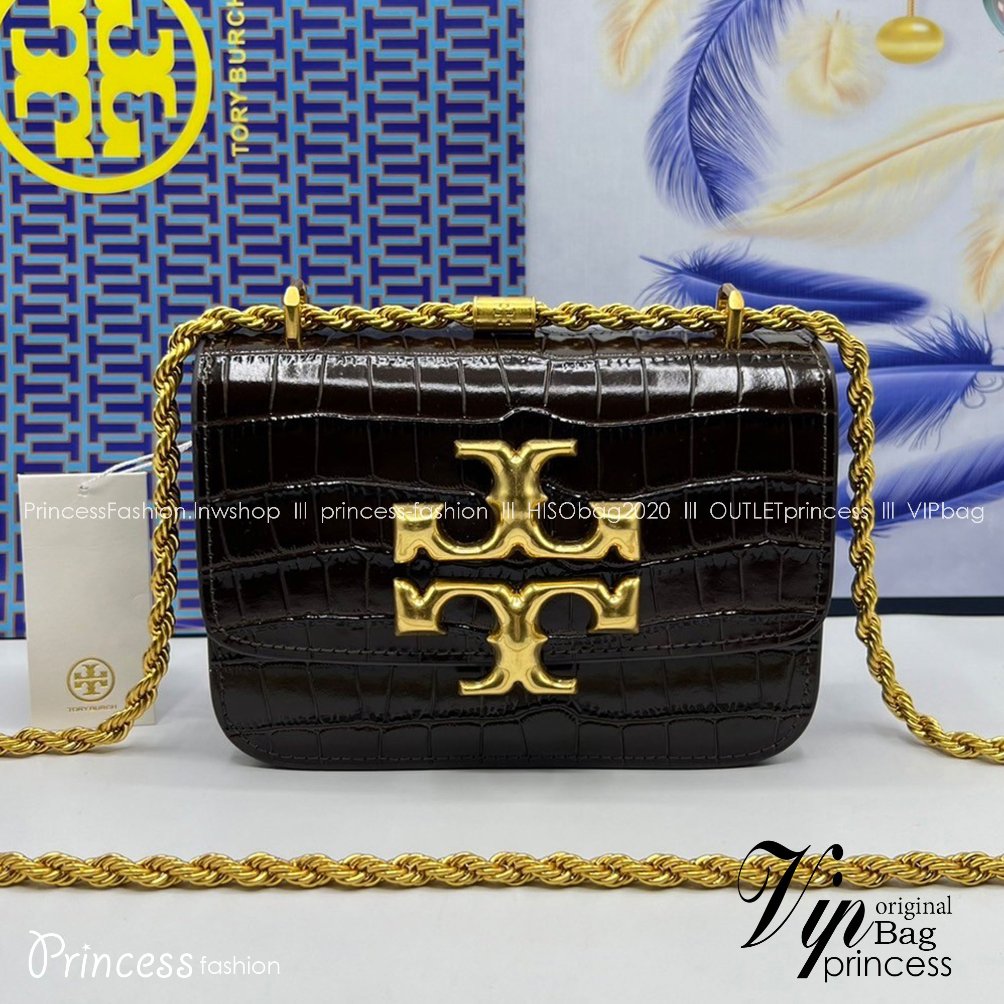 6 สี Tory Burch Croc Eleanor Small Bag / TORY BURCH ELEANOR CROC EMBOSSED LEATHER กระเป๋าสะพายหนังพิมพ์ลายจระเข้ ดีไซน์หรูหรา โด่นเด่นด้วยโลโก้แบรนด์อะไหล่ด้านหน้า และสายสะพายโลหะสีทอง