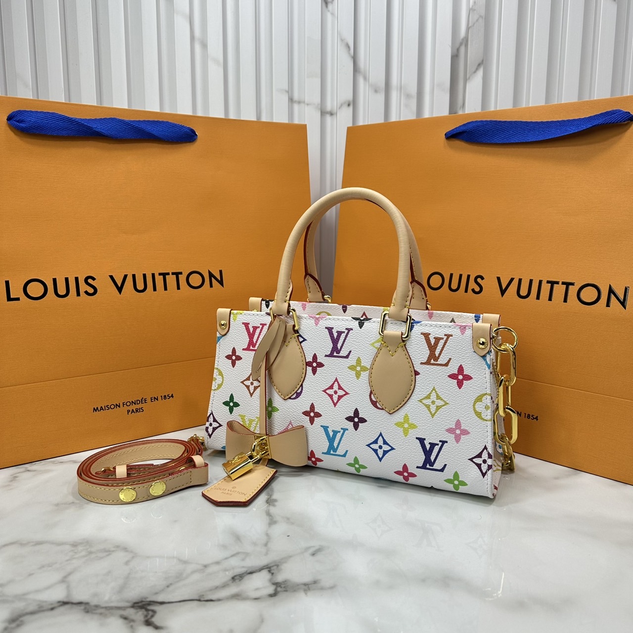 ORI หนังแท้ | LV x TM bolsa OnTheGo East West Multicolor กระเป๋าสะพายทรงโท้ทที่ใครเห็นต้องเป็นหลงรัก คอลใหม่ดีไซน์เฉดสีสันสดใส