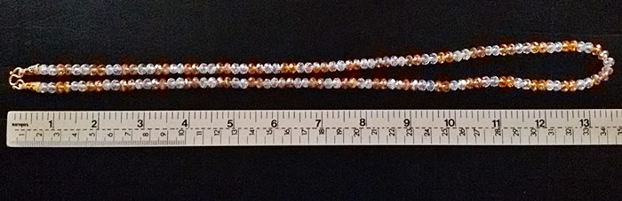 สร้อยคอคริสตัลส้มสลับขาว(ใส่พระได้1องค์)ค่ะ