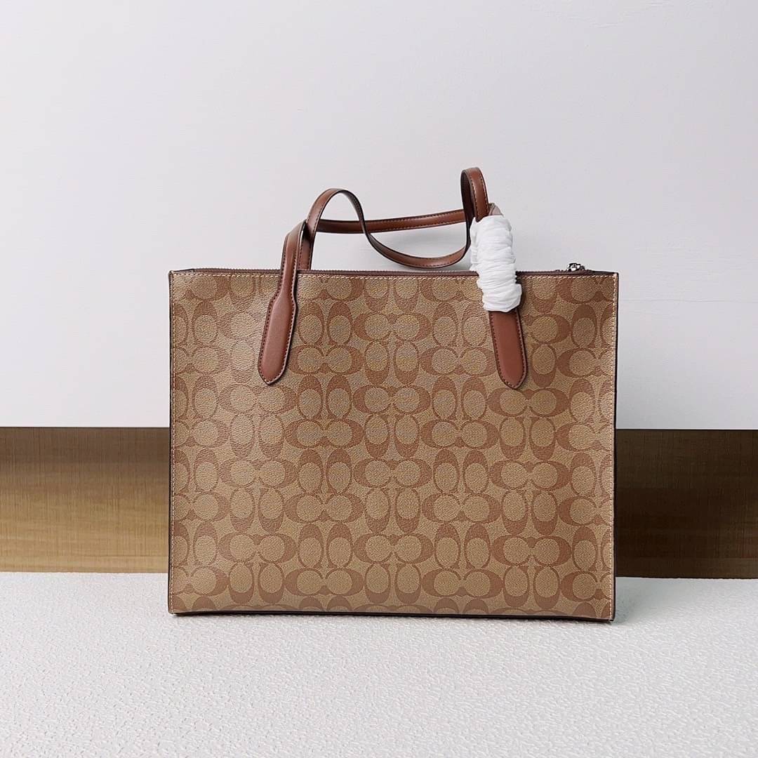 COACH NINA TOTE IN SIGNATURE CANVAS CL399 พร้อมส่ง 2 สี กระเป๋าโท้ทสะพายไหล่ ใบใหญ่ คอลเลคชั่นใหม่ ตอบโจทย์คนที่ชอบใส่ของเยอะๆได้อย่างดี ดีไซน์รูปทรงคลาสสิค เรียบหรู