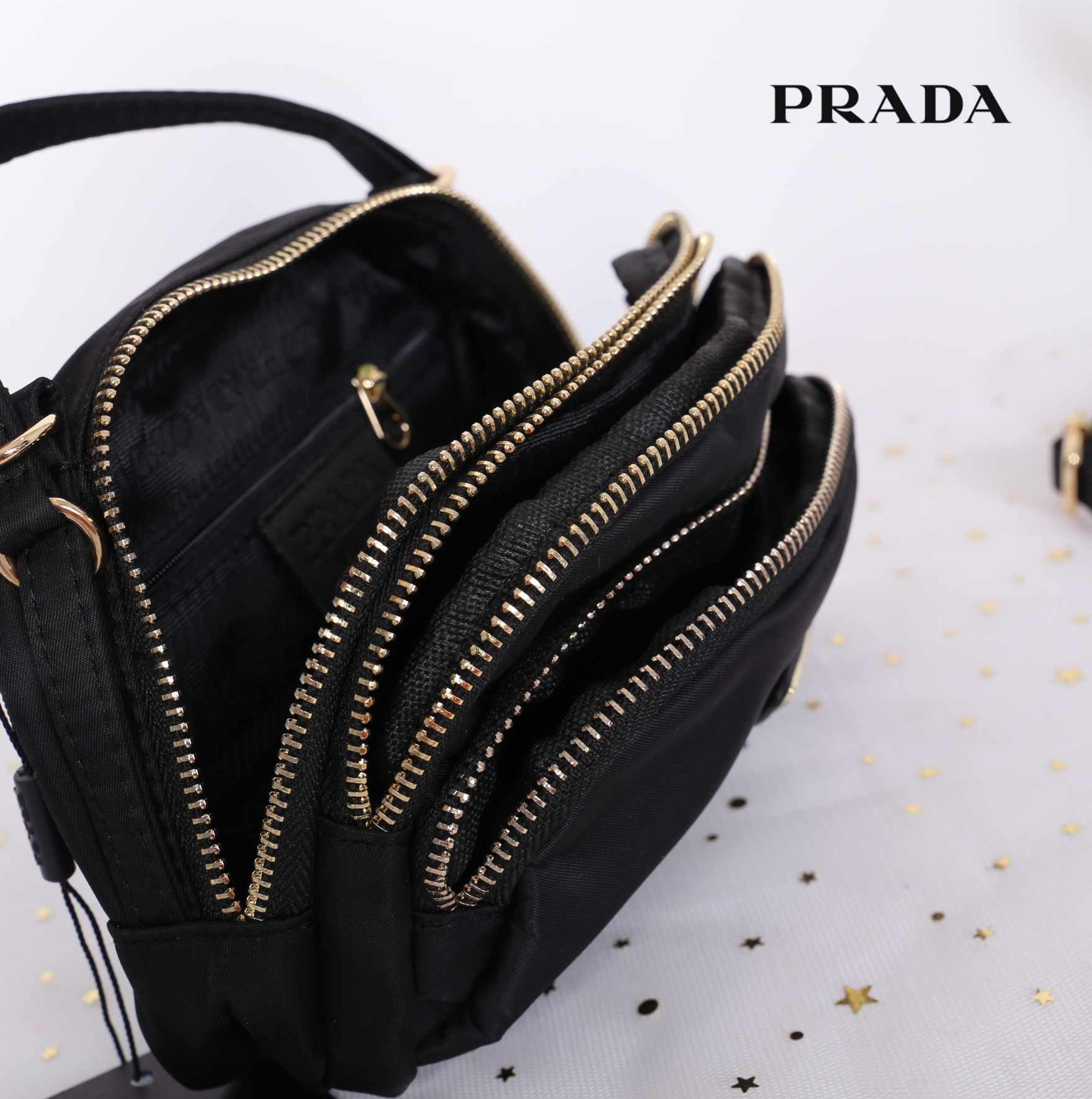 PRADA MINI 3 ZIPPER NYLON HANDBAG & SHOULDER BAG กระเป๋าถือหรือสะพายทรง dome size mini วัสดุ nylon มีหูหิ้วจับถนัดมือ