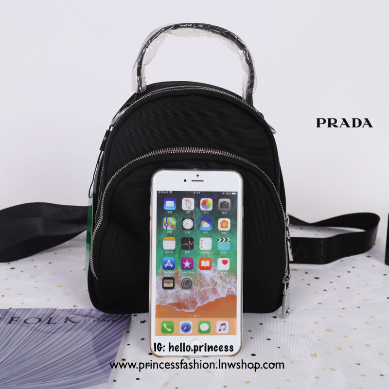 Prada mini backpack with premium gift กระเป๋าเป้ Prada size mini ทรงน่ารัก ปรับรูปแบบการสะพายได้ 2 แบบ จะสะพายแบบเป้ หรือสะพายข้างได้ทั้งนั้นเลยค่ะ วัสดุ nylon เนื้อหนาอย่างดี อะไหล่เงิน ตัวกระเป๋าแบ่งเป็น 3 ช่องซิปเป็นสัดส่วน จุของได้เยอะพอประมาณเลยค่ะ ใ