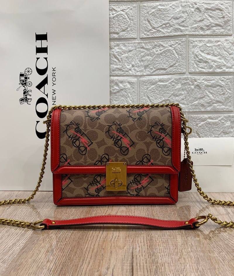 COACH HUTTON SHOULDER BAG IN SIGNATURE CANVAS