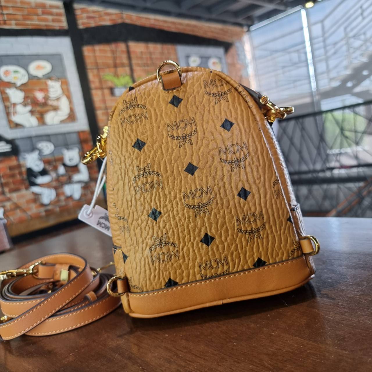 M.C.M PATRICIA BACKPACK IN VISETOS กระเป๋าสะพายไซส์ x-mini ดีเทลละเอียด ลูกเล่นเยอะ สายสะพายปรับใช้ได้หลากหลายสไตล์ ชิคมาก ปังมากค่ะแม่!! สะพายเป็นเป้ สะพายครอสบอดี้ หรือสะพายคาดอกก็ยังได้ หรือเอาสายออก ถือเดี่ยวๆก็สวยได้ไม่ธรรมดา วัสดุหนังแคนวาสคุณภาพดี 