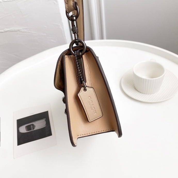 Coach Tabby Shoulder Bag 26 Polished pebble leather, suede and refined calf leather Inside zip and multifunction pockets