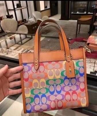 COACH C5142 COACH FIELD TOTE 22 IN RAINBOW SIGNATURE a celebration of equality, and authentic self-expression within the LGBTQIA+ community