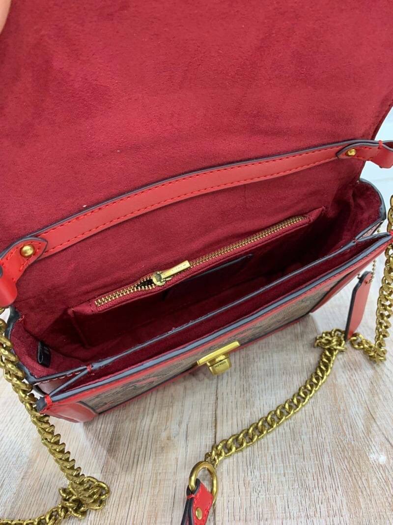 COACH HUTTON SHOULDER BAG IN SIGNATURE CANVAS