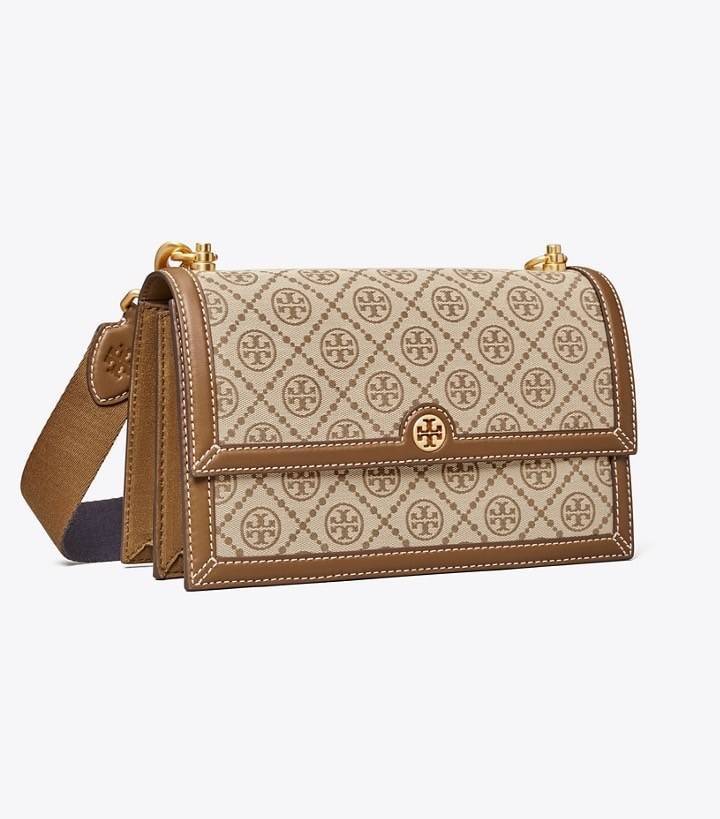 TORY BURCH 81000 MINI T MONOGRAM JACQUARD SHOULDER BAG คอลเลคชั่นฤดูใบไม้ผลิ 2021 กระเป๋าสะพายรุ่นใหม่จาก Tory Burch ดีไซน์สวยคลาสสิค แฝงไว้ด้วยความหรู ลวดลายผ้าแจ็คการ์ด T Monogram บนกระเป๋า Tory Burch นี้ เป็นการยกย่องให้กับงานควิลท์ชาวเพนซิลเวเนียดัตช์