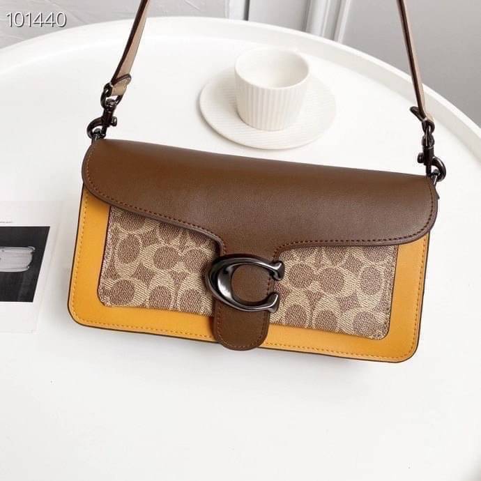 Coach Tabby Shoulder Bag 26 Polished pebble leather, suede and refined calf leather Inside zip and multifunction pockets