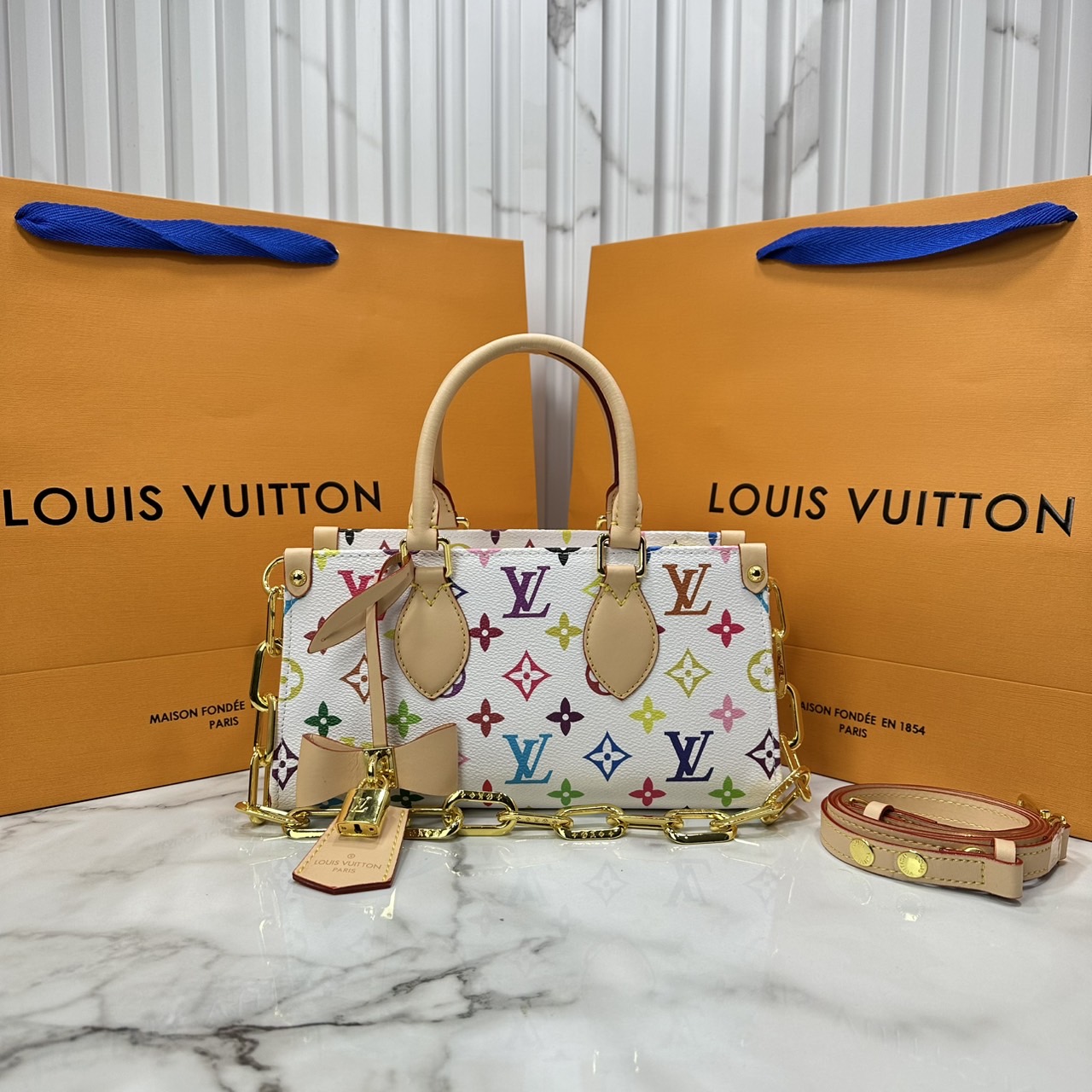 ORI หนังแท้ | LV x TM bolsa OnTheGo East West Multicolor กระเป๋าสะพายทรงโท้ทที่ใครเห็นต้องเป็นหลงรัก คอลใหม่ดีไซน์เฉดสีสันสดใส
