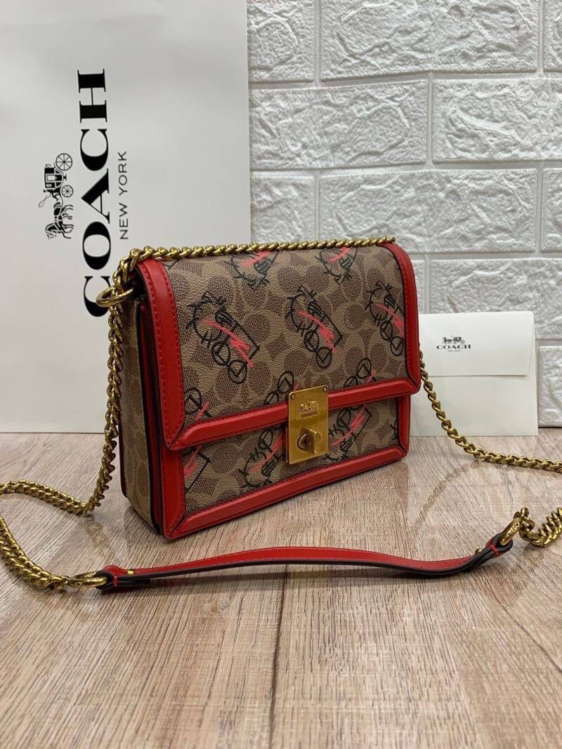 COACH HUTTON SHOULDER BAG IN SIGNATURE CANVAS