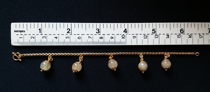 สินค้าหมดค่ะ สร้อยข้อมือผ่าหวายชุบทองเคลือบแก้วหินไหมทอง(ร่ำรวยโชคดี)ค่ะ