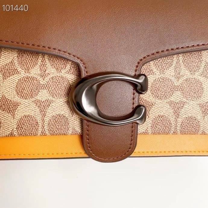 Coach Tabby Shoulder Bag 26 Polished pebble leather, suede and refined calf leather Inside zip and multifunction pockets