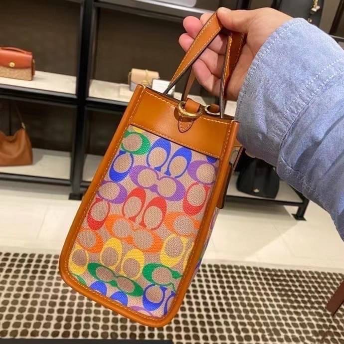 COACH C5142 COACH FIELD TOTE 22 IN RAINBOW SIGNATURE a celebration of equality, and authentic self-expression within the LGBTQIA+ community