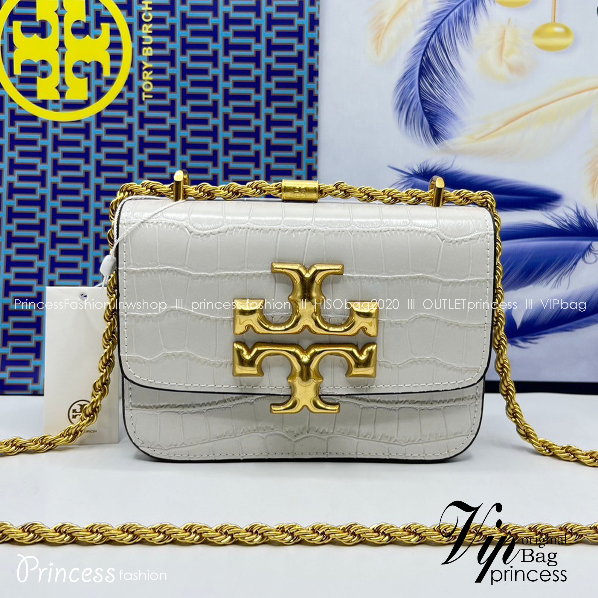 6 สี Tory Burch Croc Eleanor Small Bag / TORY BURCH ELEANOR CROC EMBOSSED LEATHER กระเป๋าสะพายหนังพิมพ์ลายจระเข้ ดีไซน์หรูหรา โด่นเด่นด้วยโลโก้แบรนด์อะไหล่ด้านหน้า และสายสะพายโลหะสีทอง