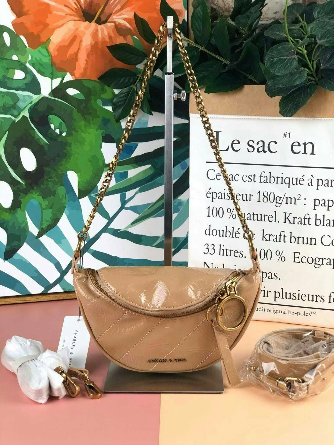 CHARLES & KEITH WRINKLED EFFECT RING ZIP TASSEL CROSSBODY BAG กระเป๋าสาระพัดประโยชน์ ใช้คาเอว คาดอก หรือจะสะพายแบบครอสบอดี้ได้ค่า 💥💥 มีโลโก้แบรนด์ที่ด้านหน้า เปิดปิดแบบซิปคู่เก๋ๆ ด้านในมีช่องใส่บัตรได้ 3 ช่อง รุ่นนี้ใส่ iPhone plus ได้พอดี