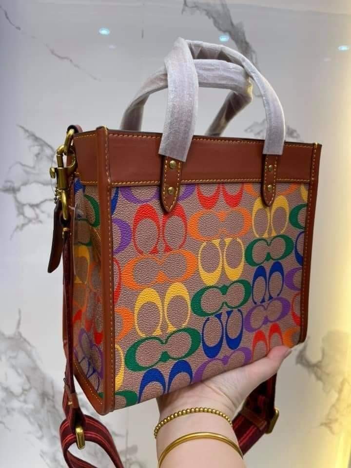 COACH C5142 COACH FIELD TOTE 22 IN RAINBOW SIGNATURE a celebration of equality, and authentic self-expression within the LGBTQIA+ community