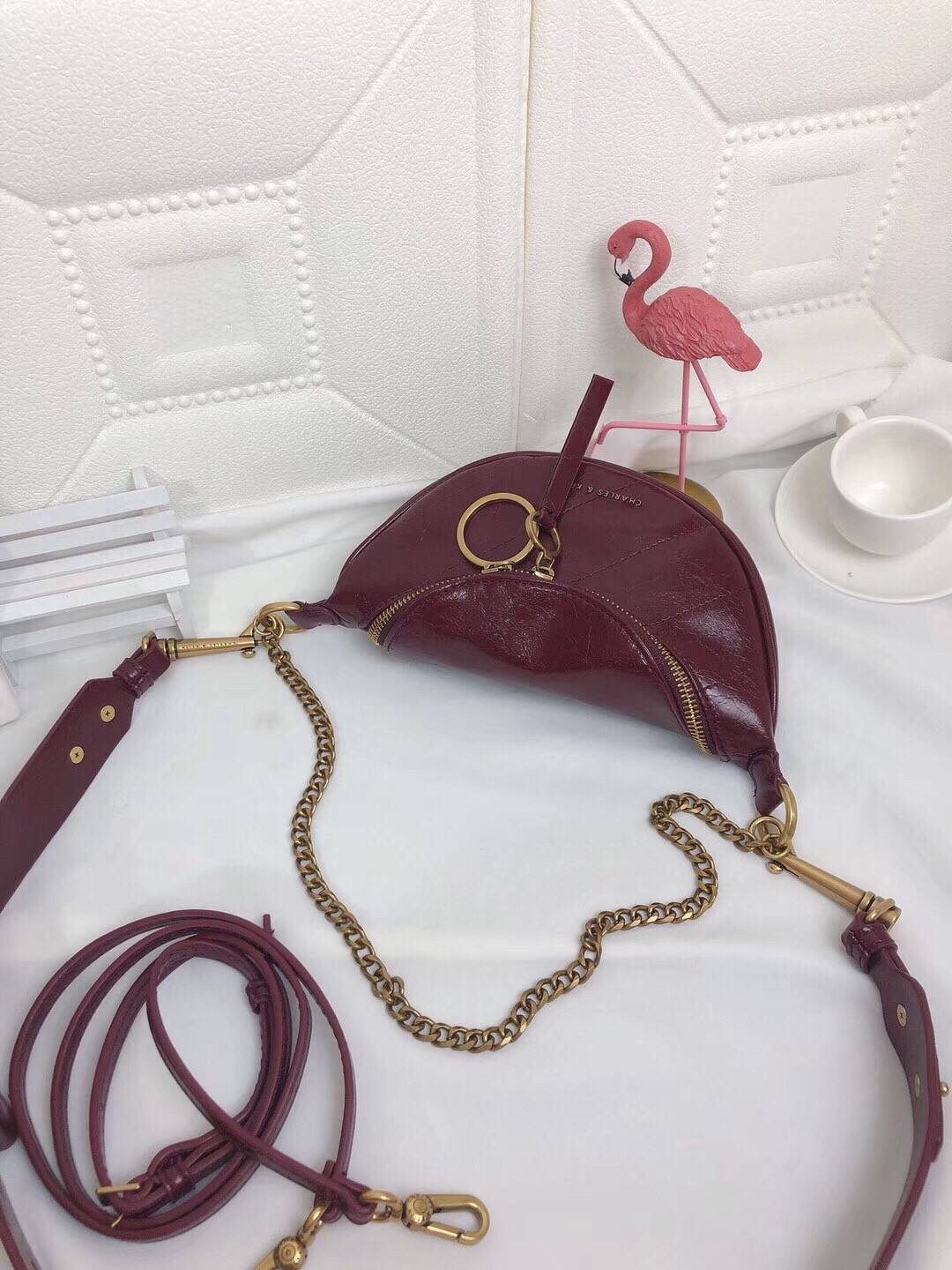 CHARLES & KEITH WRINKLED EFFECT RING ZIP TASSEL CROSSBODY BAG กระเป๋าสะพาย/คาดเอว/คาดอกรุ่นใหม่ล่าสุด เปิด-ปิดด้วยซิป ภายในโล่งกว้างมีช่องเล็กใส่บัตร จุของได้เยอะดีไซต์เก๋ไม่ซ้ำใคร สามารถสะพายได้หลายแบบไม่จำเจ ราคาสุดคุ้มห้ามพลาดค่ะ