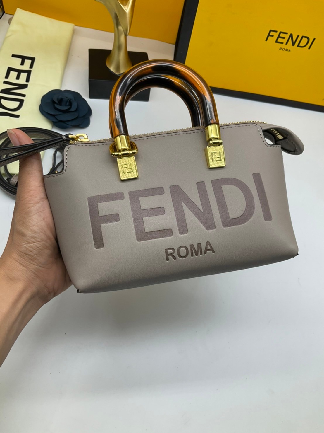 FENDI By The Way Mini Bag พร้อมส่งที่ไทย ภาพถ่ายจากงานขายจริง Iconic mini By The Way Boston bag made FENDI ROMA lettering and rigid tortoiseshell-effect plexiglass handles.
