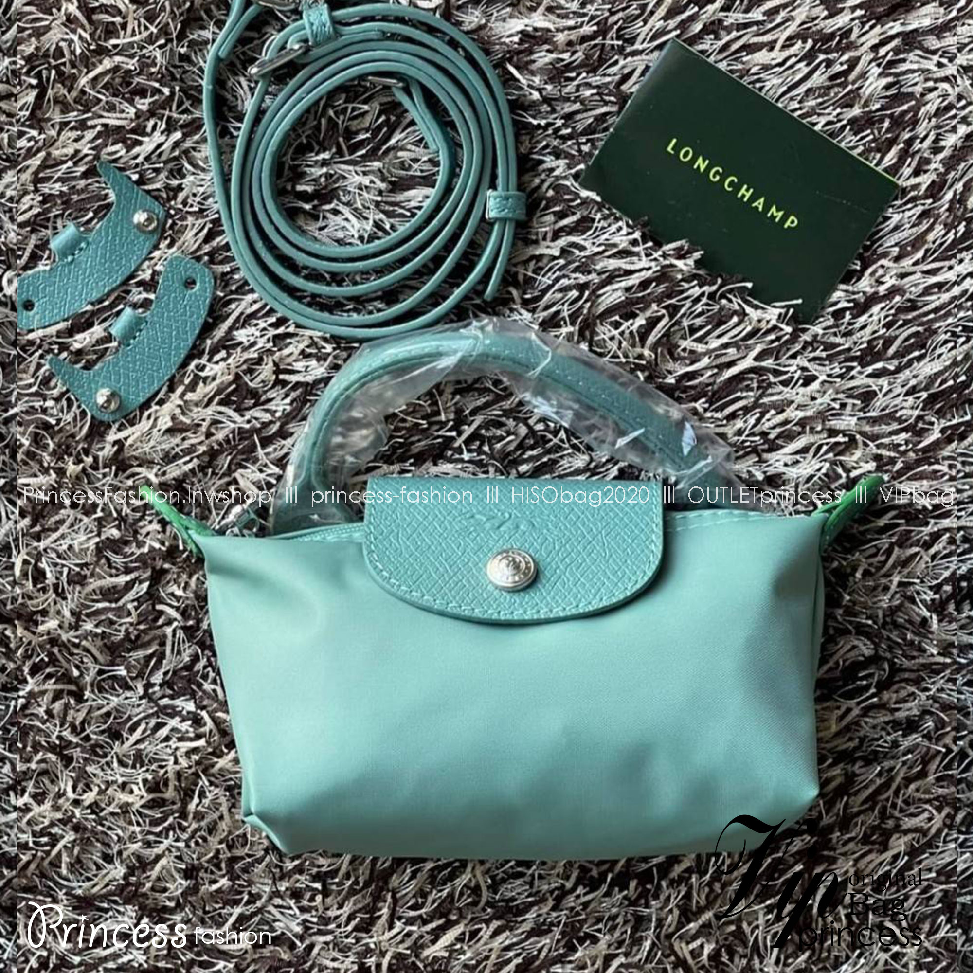 LONGCHAMP LE PLIAGE ORIGINAL Pouch with handle กระเป๋าถือขนาดมินิทรงpouch ให้ความหรูหราจาก Le Pliage (เลอ ปลิยาจ) ในขณะที่ที่ปิดแบบซิปช่วยให้คุณมั่นใจได้