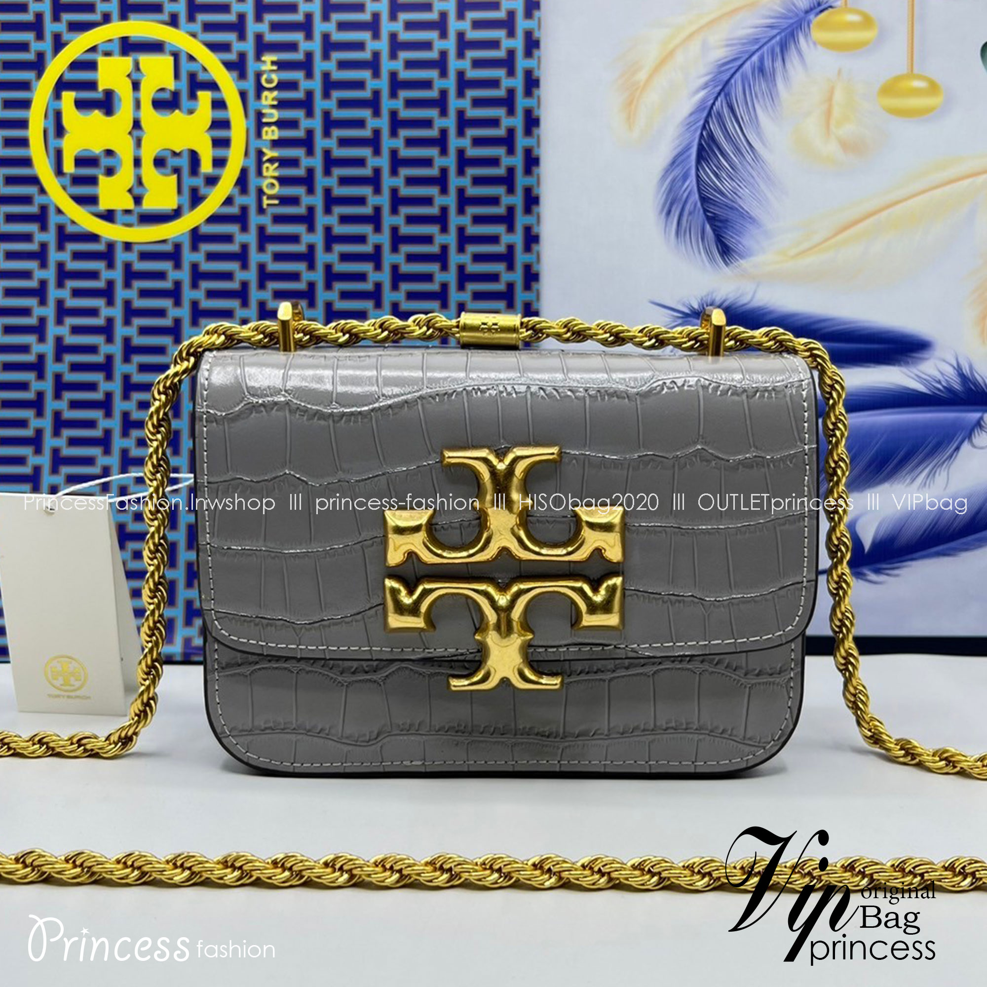 6 สี Tory Burch Croc Eleanor Small Bag / TORY BURCH ELEANOR CROC EMBOSSED LEATHER กระเป๋าสะพายหนังพิมพ์ลายจระเข้ ดีไซน์หรูหรา โด่นเด่นด้วยโลโก้แบรนด์อะไหล่ด้านหน้า และสายสะพายโลหะสีทอง