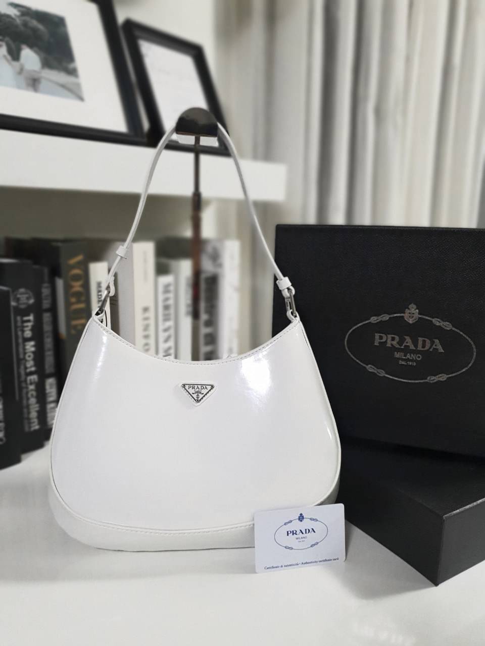 Prada Cleo brushed leather shoulder bag กระเป๋าทรงสวยยอดฮิต กับแบรนด์ PRADA งานพรีเมียมกิ้ฟท์จากแบรนด์ ทรงสะพายไหล่สวยหรูอยู่ทรง PRADA CLEO หนังเรียบดำเงาหรูสุดคลาสสิต เปิดปิดด้วยกระดุมอะไหล่เงินทั้งใบ ด้านในใส่กระเป๋าสตางค์ยาว มือถือ ของจุกจิกได้เยอะ มีป