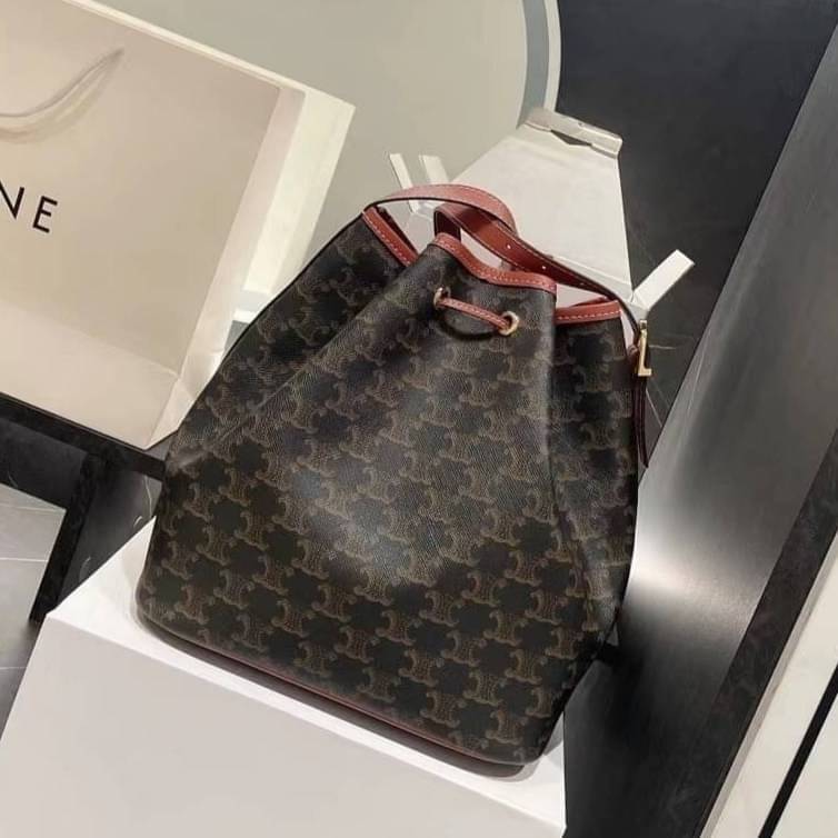 CELINE MEDIUM DRAWSTRING BAG IN TRIOMPHE CANVAS TAN