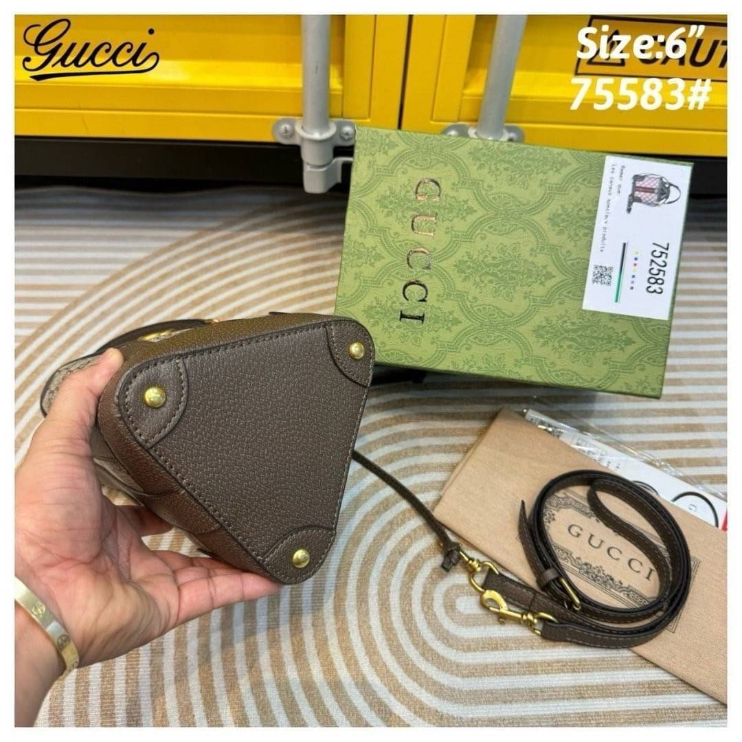 GUCCI Ophidia GG Bucket Triangle Bag กระเป๋าสะพายทรงบัคเก็ตสามเหลี่ยม รุ่นใหม่ สุดไอโคนิค เพิ่มกิมมิกแต่งแถบอะไหล่สีทอง สวยหรูคลาสิกสุดๆ