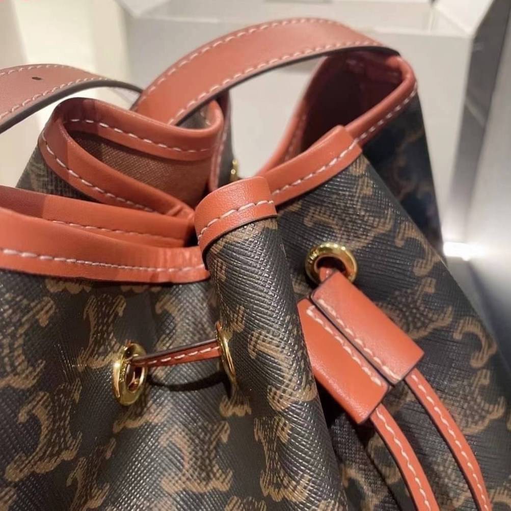 CELINE MEDIUM DRAWSTRING BAG IN TRIOMPHE CANVAS TAN