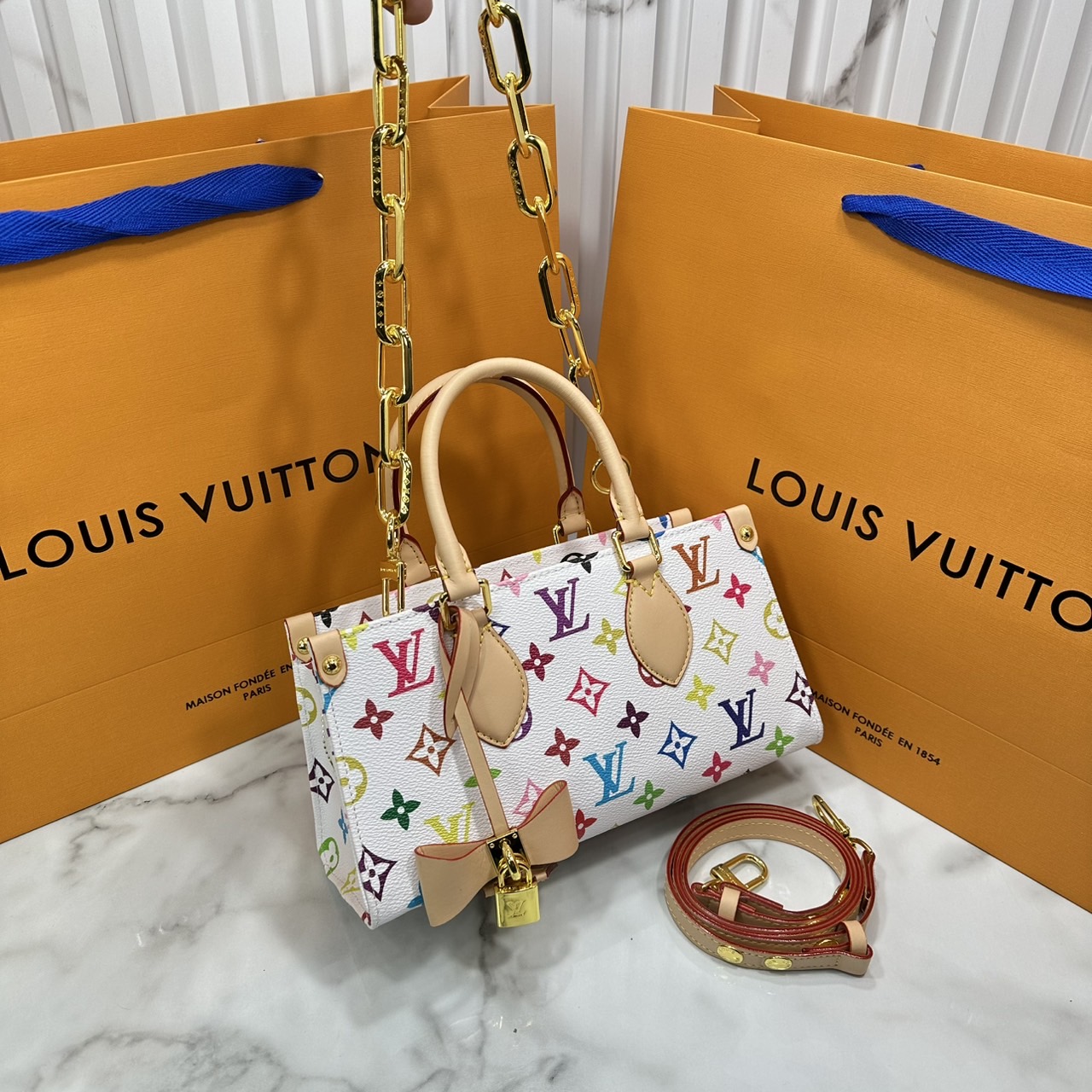 ORI หนังแท้ | LV x TM bolsa OnTheGo East West Multicolor กระเป๋าสะพายทรงโท้ทที่ใครเห็นต้องเป็นหลงรัก คอลใหม่ดีไซน์เฉดสีสันสดใส