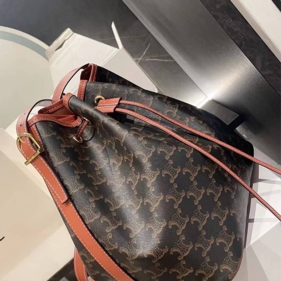 CELINE MEDIUM DRAWSTRING BAG IN TRIOMPHE CANVAS TAN