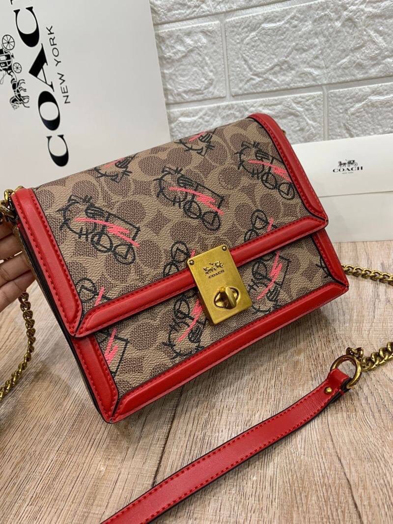 COACH HUTTON SHOULDER BAG IN SIGNATURE CANVAS