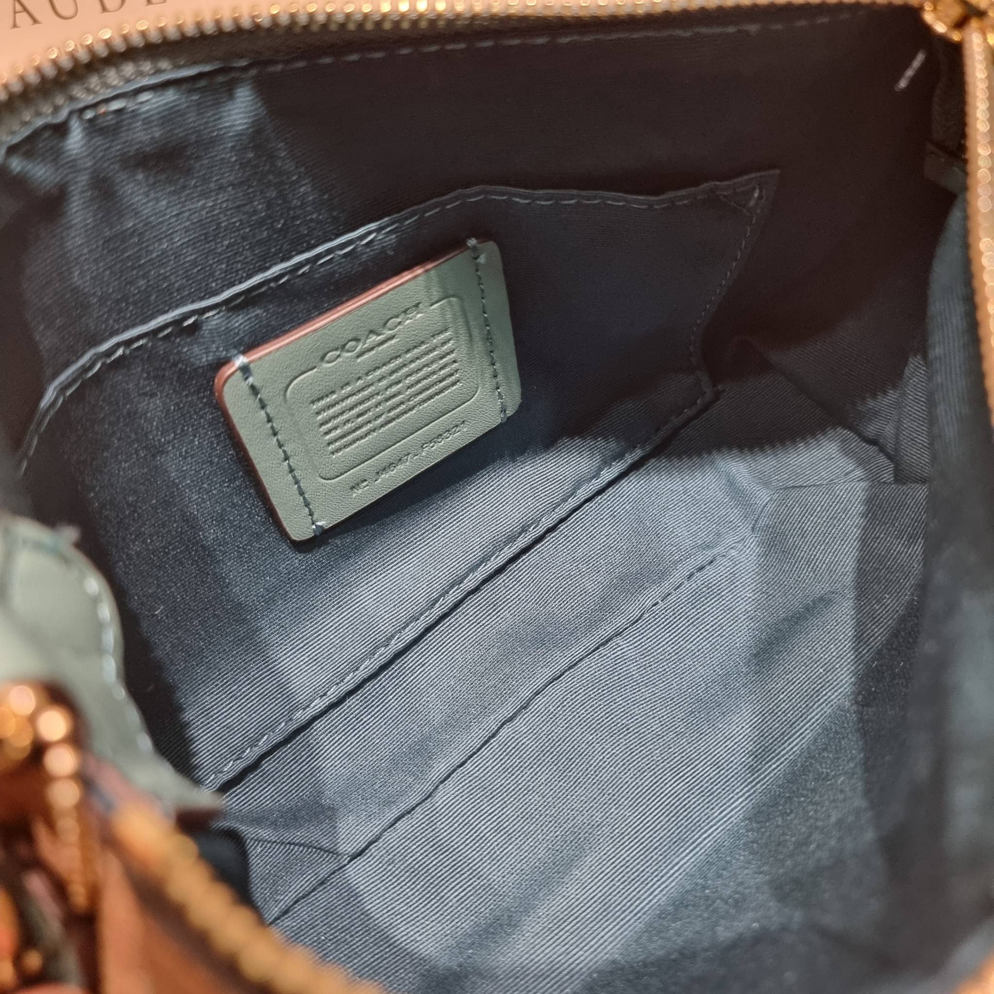 COACH TOP HANDLE POUCH F58321 พร้อมส่ง 9 สี กระเป๋าทรงพอช ยอดฮิต ยกขึ้นแท่น ด้วยดีไซน์ที่ออกมาให้ใช้งานได้ง่าย ขนาดกำลังเหมาะ