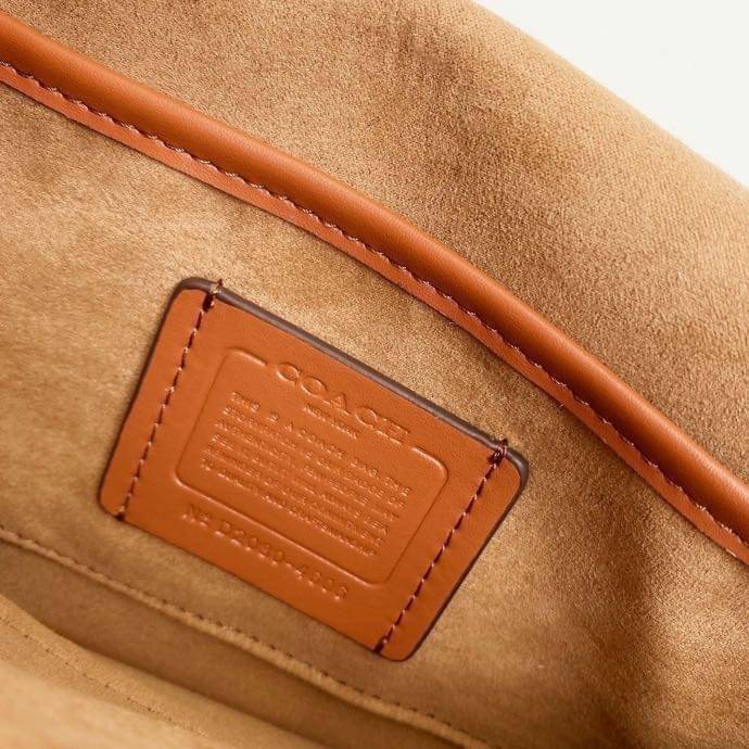 Coach Tabby Shoulder Bag 26 Polished pebble leather, suede and refined calf leather Inside zip and multifunction pockets