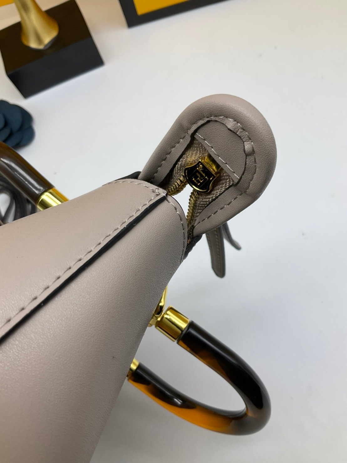 FENDI By The Way Mini Bag พร้อมส่งที่ไทย ภาพถ่ายจากงานขายจริง Iconic mini By The Way Boston bag made FENDI ROMA lettering and rigid tortoiseshell-effect plexiglass handles.