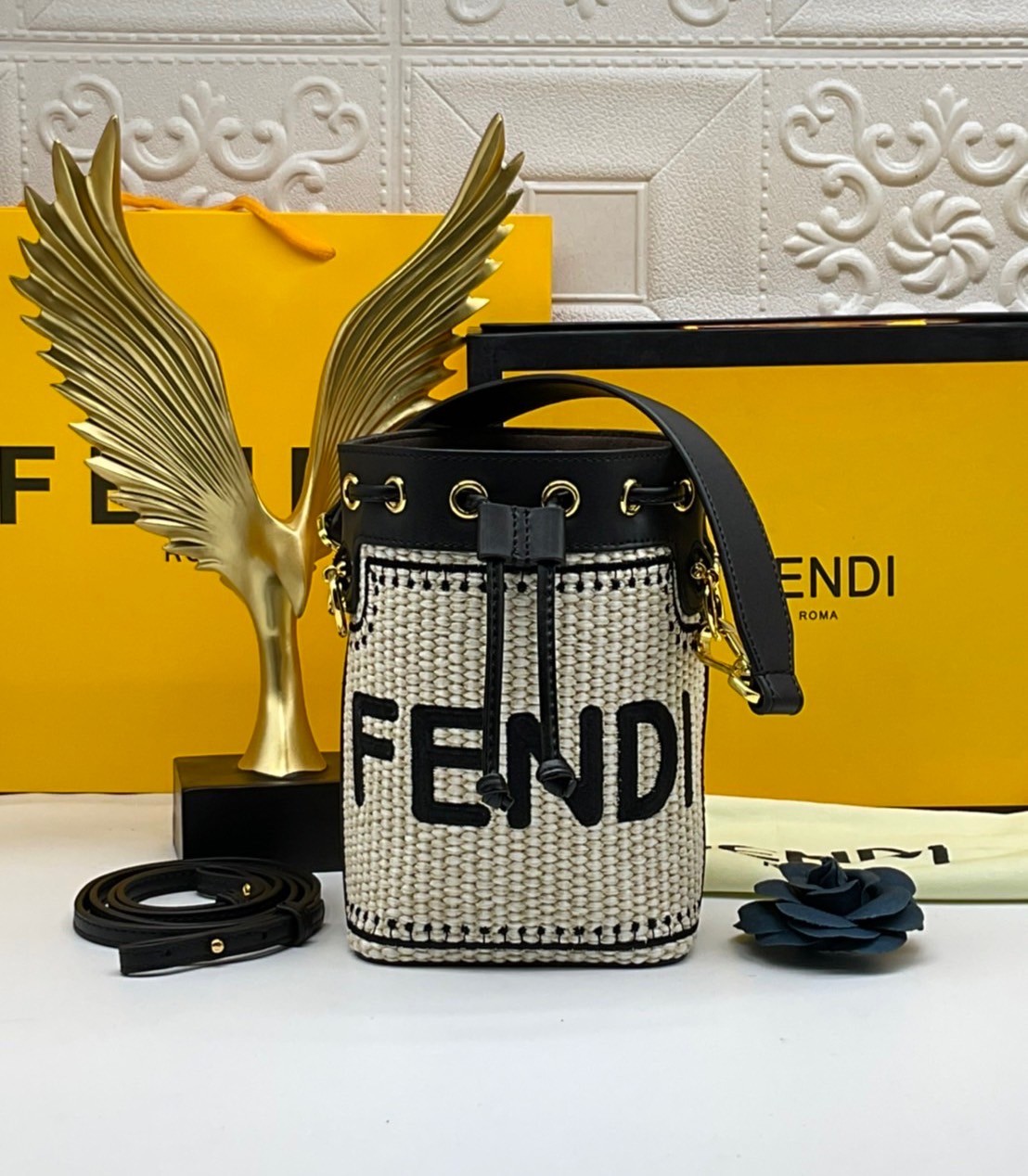 FENDI Mon Tresor Beige and black straw mini bag / Mon Tresor bucket bag made of natural-coloured woven straw with a moss-stitch effect, with black straw Fendi lettering. กระเป๋าสะพายทรงบัคเก็ตมินิน่ารัก อะไหล่ปั้มแบรนด์สีทอง Rare items เด็ดๆแบบนี้ห้ามพลาด