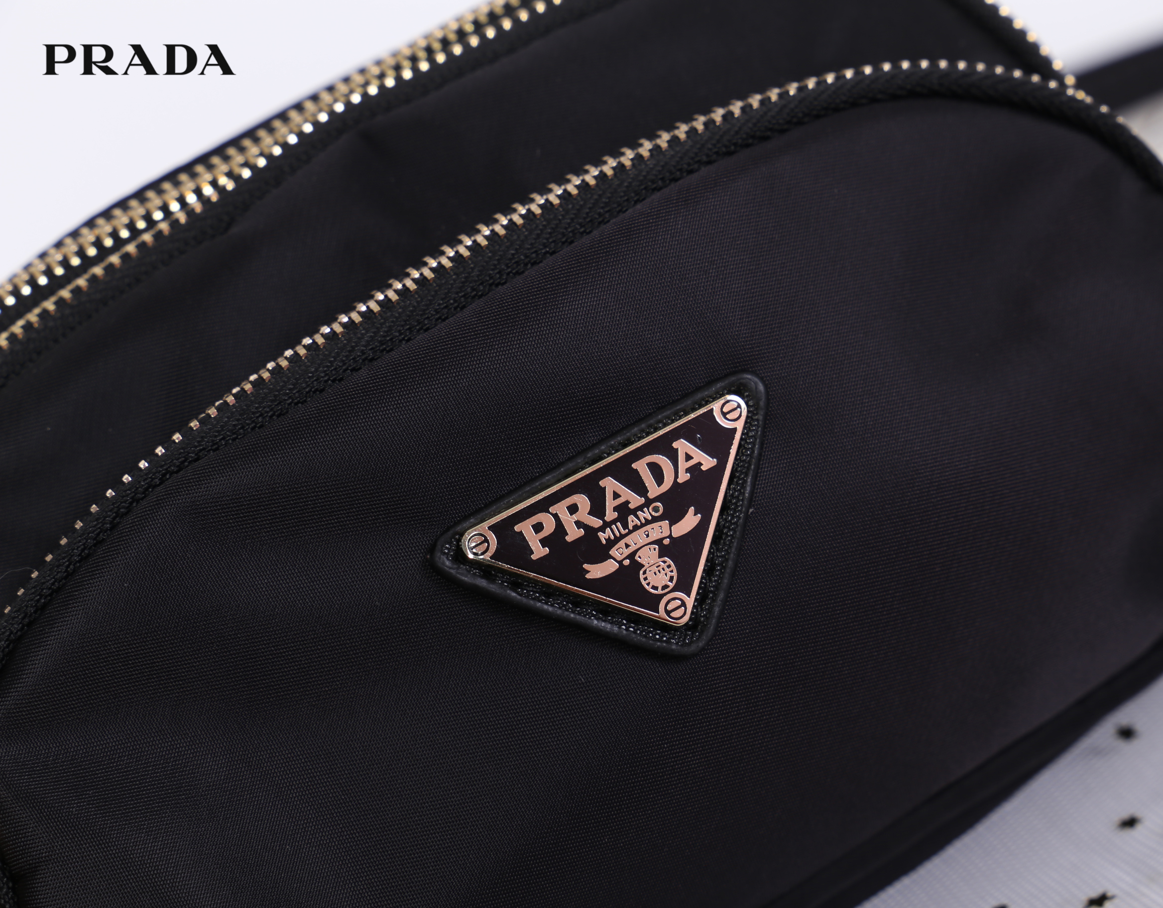 PRADA MINI 3 ZIPPER NYLON HANDBAG & SHOULDER BAG กระเป๋าถือหรือสะพายทรง dome size mini วัสดุ nylon มีหูหิ้วจับถนัดมือ