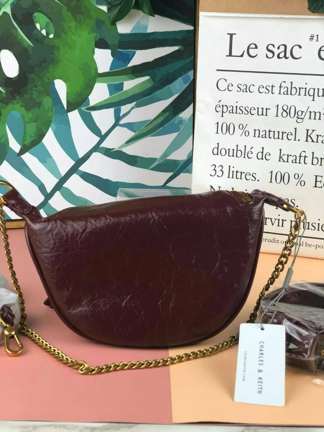 CHARLES & KEITH WRINKLED EFFECT RING ZIP TASSEL CROSSBODY BAG กระเป๋าสาระพัดประโยชน์ ใช้คาเอว คาดอก หรือจะสะพายแบบครอสบอดี้ได้ค่า 💥💥 มีโลโก้แบรนด์ที่ด้านหน้า เปิดปิดแบบซิปคู่เก๋ๆ ด้านในมีช่องใส่บัตรได้ 3 ช่อง รุ่นนี้ใส่ iPhone plus ได้พอดี