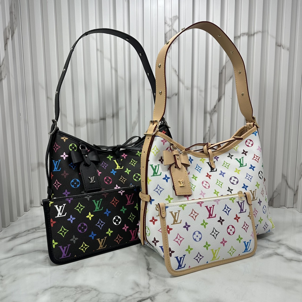 LV x TM CarryAll PM bag Murakami กระเป๋าทรงโท้ทแครี่ออลสุดคลาสสิกแต่งแต้มดีเทลเปี่ยมชีวิตชีวาจากคอลเลคชั่น LV x Murakami ด้วยลายโมโนแกรมสุดไอคอนิกเปี่ยมสีสันใหม่